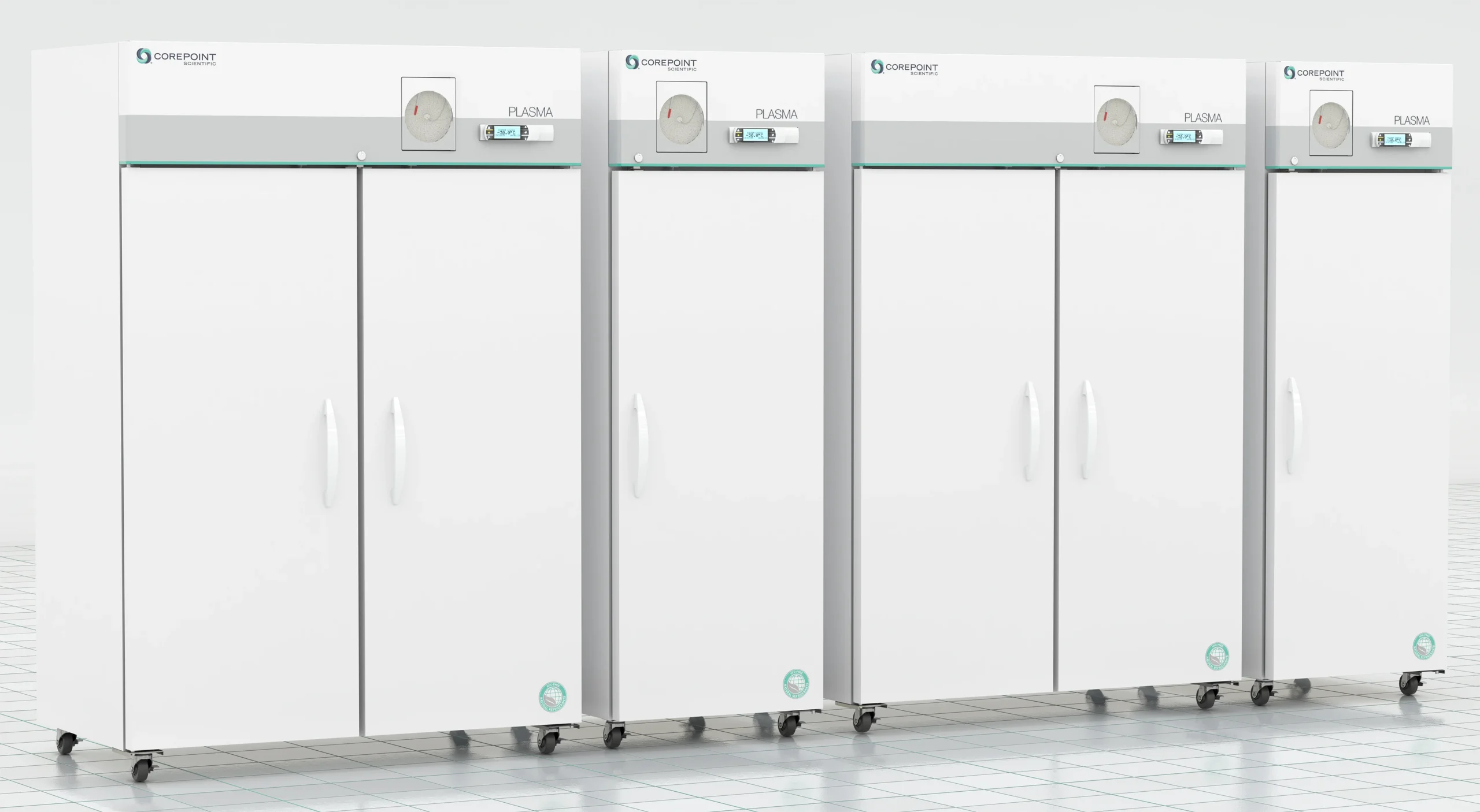 Four large, white blood bank and plasma freezers with double doors, digital displays, and temperature dials stand side by side on wheels, placed on a tiled floor in a clean, bright laboratory environment.